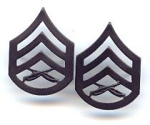 E. Staff Sergeant (SSgt) Black Metal Chevrons